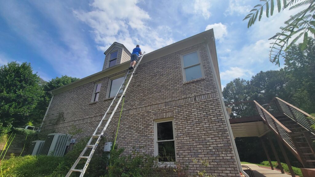 Man washing a roof in cartersville GA